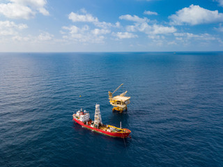 Soil Boring Boat (a geotechnical drilling cum analogue survey vessel) close to a oil platform