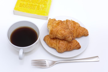 black coffee and fresh baked croissants
