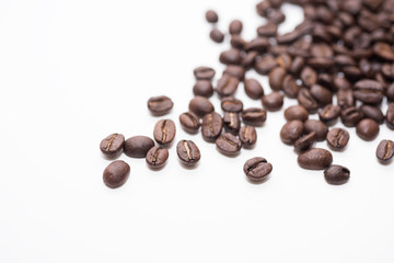 Roasted coffee beans on white background