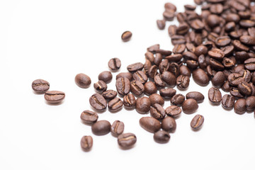 Roasted coffee beans on white background