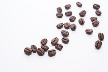 Roasted coffee beans on white background