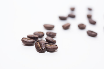 Roasted coffee beans on white background