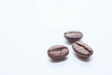 Roasted coffee beans on white background