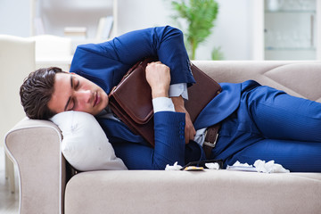 Obraz premium Sick employee staying at home suffering from flue