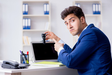 Young help desk operator working in office