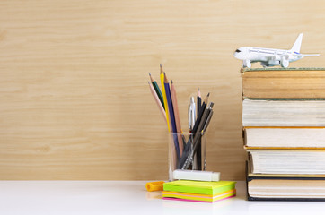 Hardback or textbook stacked and stationary placed on the table.