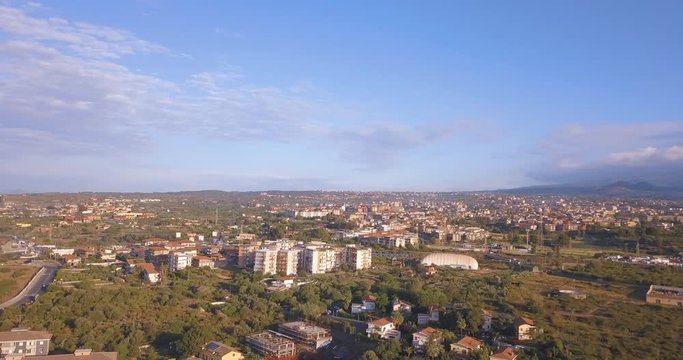 Aerial view of the Catania city from above with Etna volcano on the background