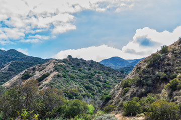 Fototapeta na wymiar Clouds from recent rain cover valley in California mountains