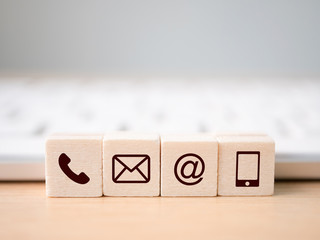Wood block symbol telephone, mail, address and mobile phone. Website page contact us or e-mail...