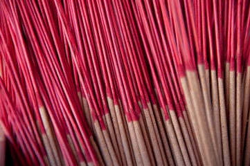 Fototapeta premium Red classical Asian incense sticks in pair