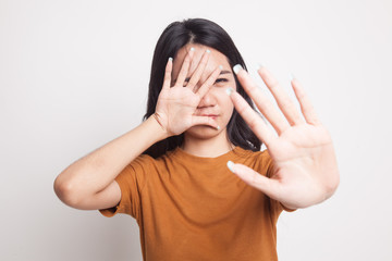 Young Asian woman hide her  face.