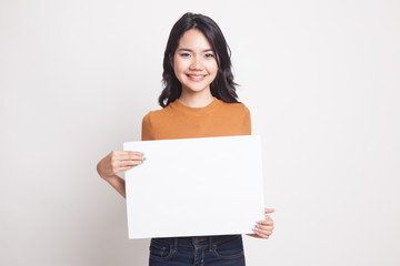 Fototapeta premium Young Asian woman with white blank sign.