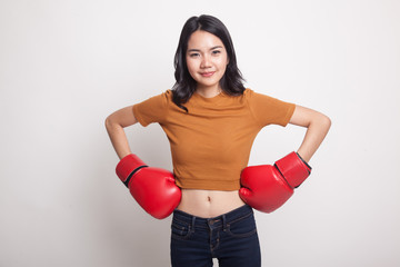 Young Asian woman with red boxing gloves.