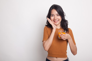 Happy Young Asian woman drink orange juice.