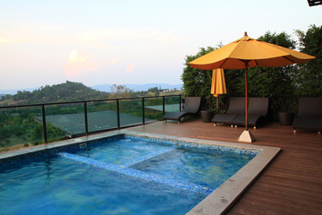 blue swimming pool  and sofa outdoor resort on nature landscape