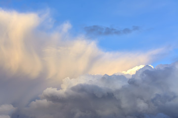 Cumulus clouds in the evening sunset sky.