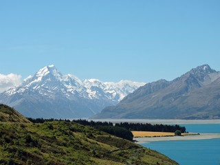 View on snow-capped mountain at blue Lake Pukaki, New Zealand, Aoraki / Mount Cook