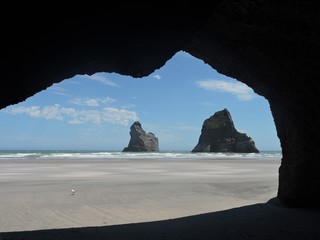 Rock formations at the beach, seen out of a cave, New Zealand