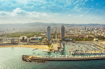 Barcelona aerial, Port Olimpic with city skyline, Spain. Helicopter view