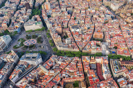 Barcelona aerial top view, Placa de Catalunya and famous La Rambla street, Spain. Late afternoon light