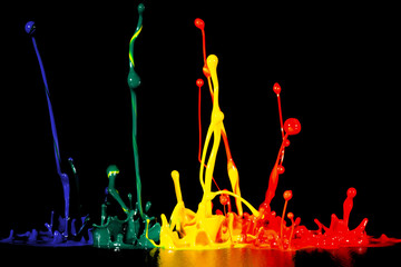 splash of acrylic paint, colored abstract background on black