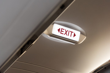 Emergency exit sign in the airplane.