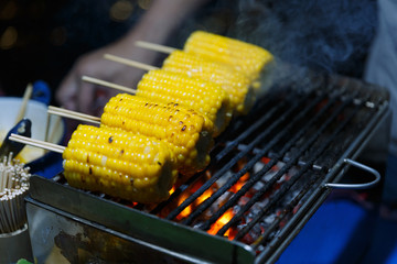 Grilled corn on the hot stove.