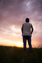 Silhouette of a man against a beautiful sunset sky