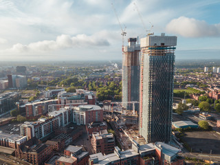 Manchester City Centre Drone Aerial View Above Building Work Skyline Construction Blue Sky Summer...