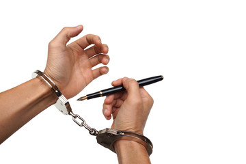 Hand using a pen trying to unlock handcuffs - Freedom of the press is at risk concept - World press...