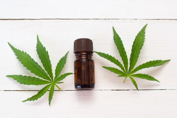hemp oil on a  white wooden table