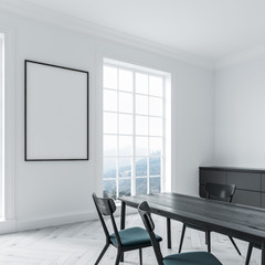 White dining room interior, black table, poster