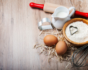 Obraz na płótnie Canvas Baking ingredients - flour, eggs and pin