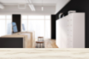 Black office wooden reception table side view blur