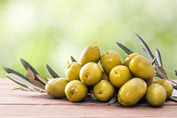 olives on wood with background