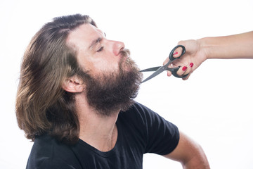 Beard styling and cut. Close up of a styling a beard. Advertising and barber shop concept isolated on white