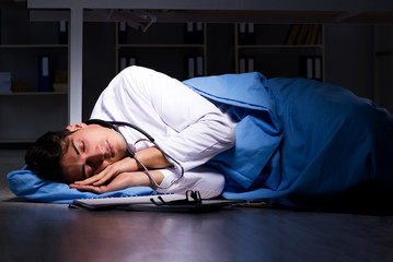 Doctor working night shift in hospital after long hours