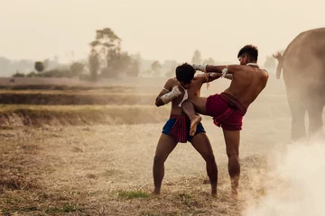 Foto auf Acrylglas Martial arts of Muay Thai,Action Muay Thai tradition fighters of Thailand. © visoot