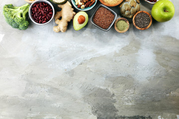 superfood concept on stone table with avocado, goji and nuts and seeds.