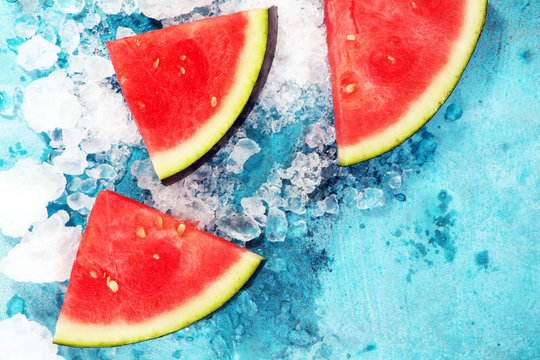 watermelon on blue background. juicy summer fruit in slices