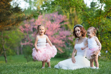 Naklejka premium woman and children in nature