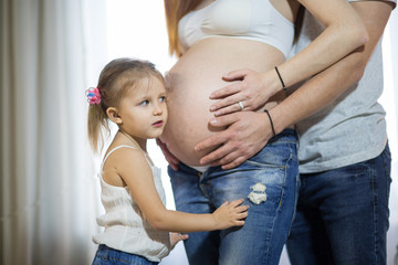 Family with a child and pregnant mother