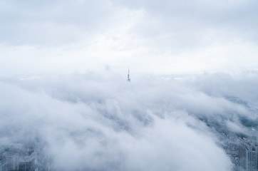 Fototapeta na wymiar Ariel view of modern city, in cloud