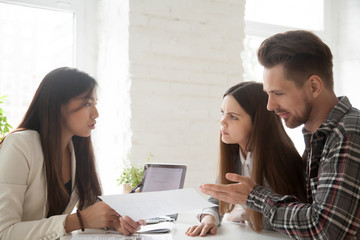 Asian lawyer consulting unconvinced angry deceived clients complaining on bad contract demanding...