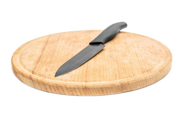 Kitchen knife on cutting board. Isolated on white.