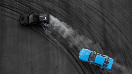 Aerial top view two car battle drifting car.