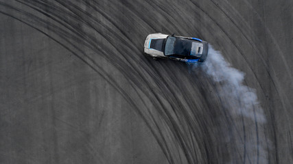 Aerial top view drifting car on asphalt road race track, Auto or automobile adrenaline active...