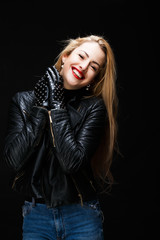 Photo of smiling blonde in leather jacket