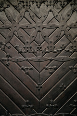 Old black metallic door. Close up view, texture, pattern