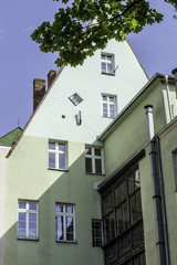 Renovated old houses. View to the facade of the house from the yard. Gothic and baroque elements of buildings  . Old Town in Wroclaw, Poland.